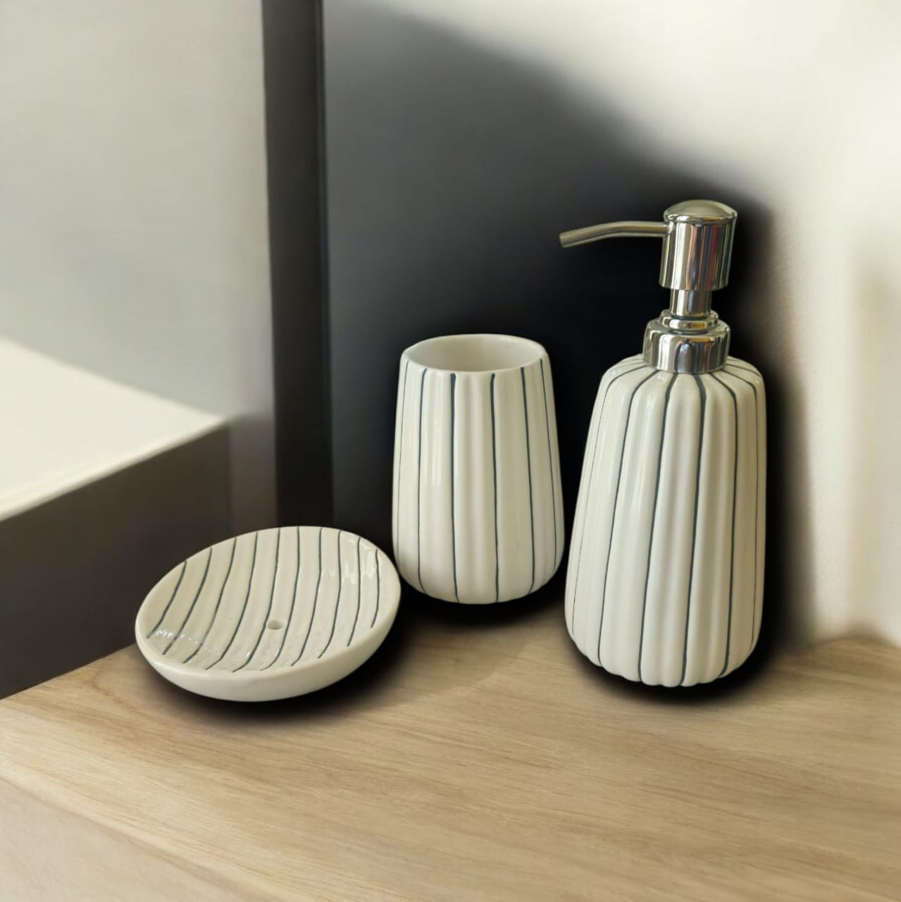WhatsApp Image 2026-04-09 at 10.22.38 PM (1) Ceramic Liquid Soap Dispenser Set with Soap Dish and Toothbrush Stand, Leak-Proof, Silver Glossy Finish, BPA-Free Pump, for Wash Basin (White & Black) - Image 1